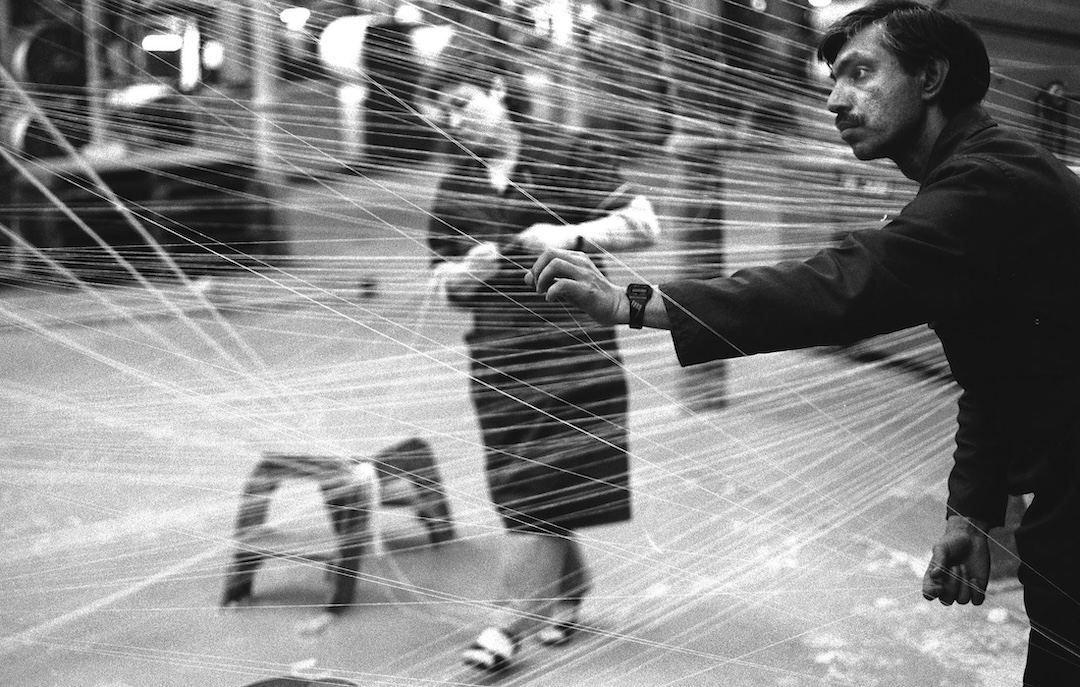 Black and white photograph of two employees working in the warping department of Drummonds Mill. Photograph: Tim Smith