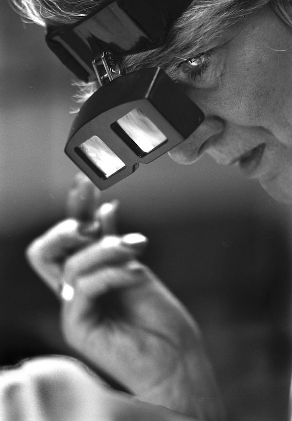 A black and white portrait photograph of a woman's face, wearing glasses for burling and mending. Photograph: Tim Smith