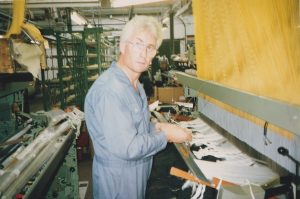 A coloured photograph of Leo Higgins, a male twister for E&S Smiths using his machinery. Photograph: Richard Smith