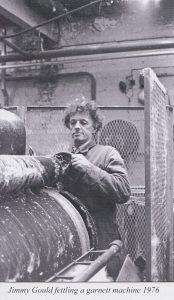 A black and white photograph of a man named Jimmy Gould fettling a Garnett machine in 1976. Photograph: Roger Davy