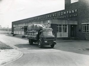 A black and white photograph of a loaded van outside Woolcombers Company building. Photograph: Richard Freeman